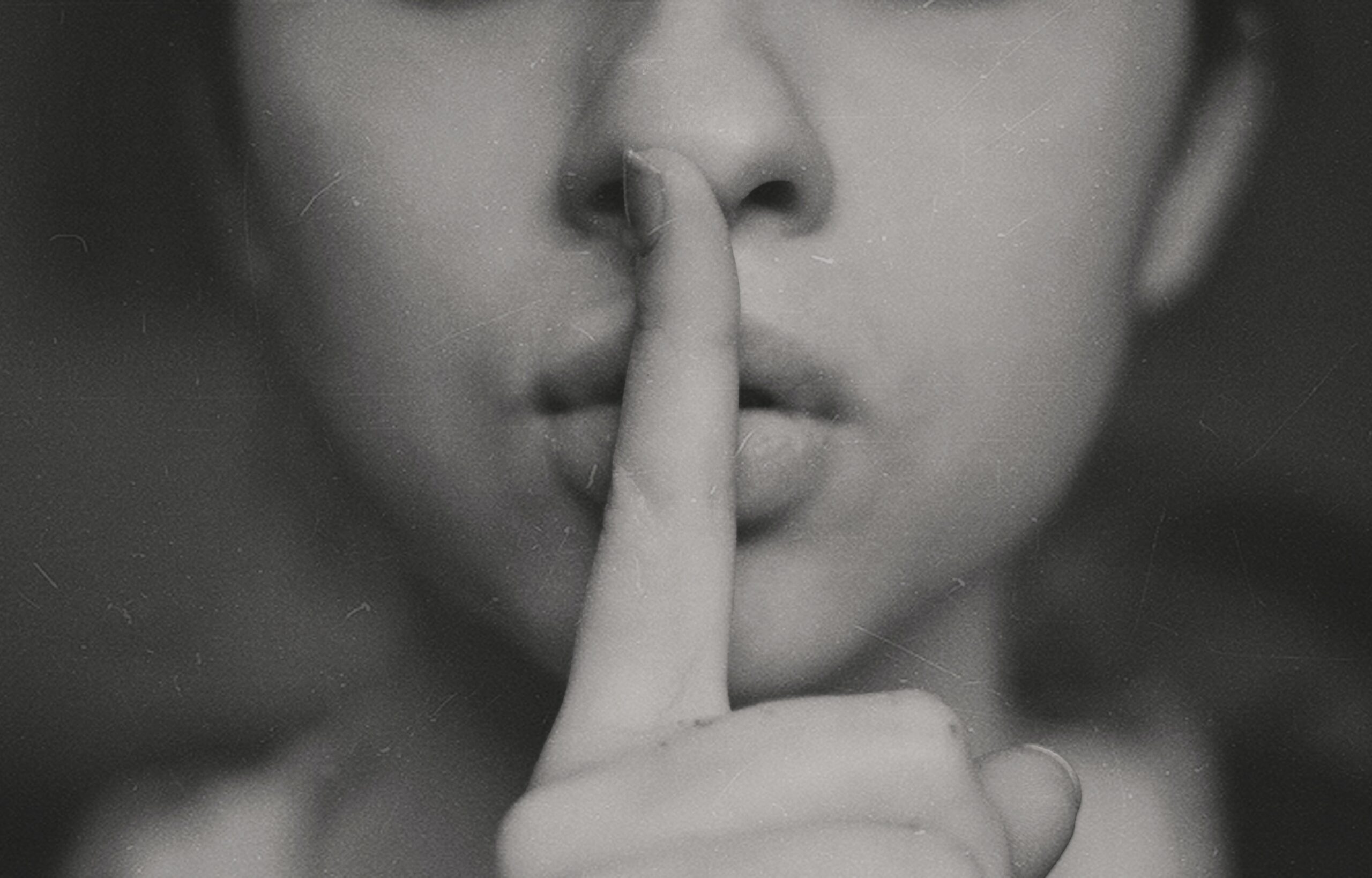 secret shh finger on mouth