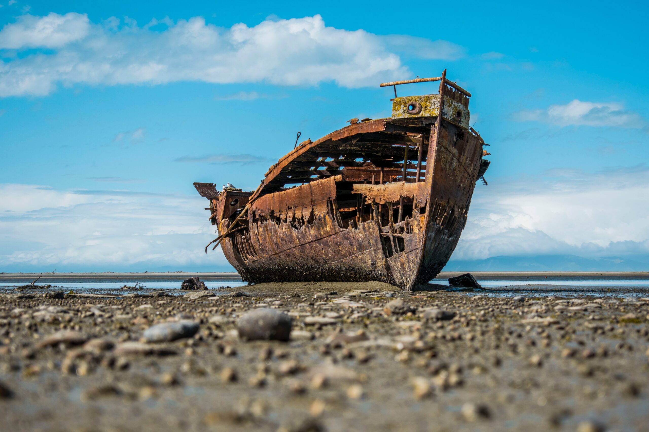 ship wreck abandoned on shore feat